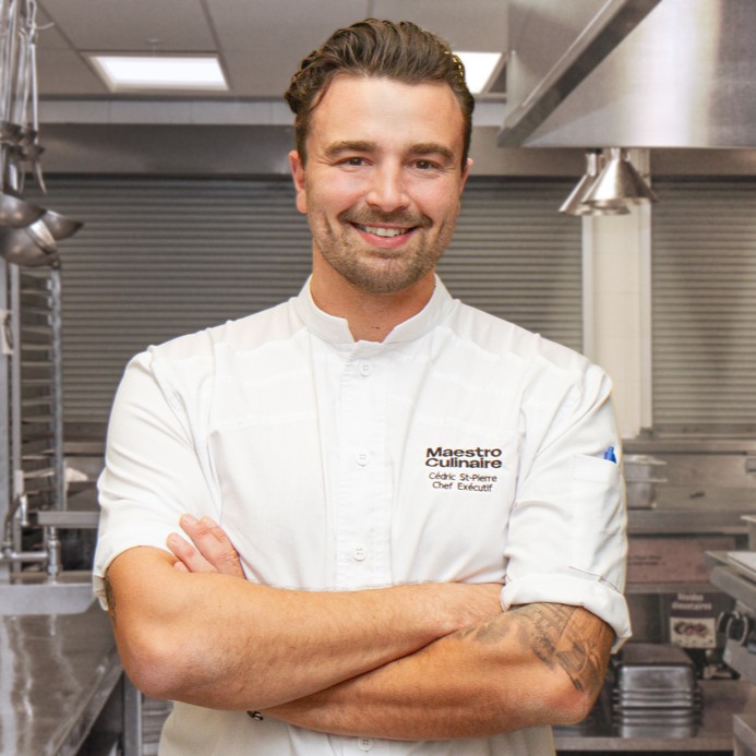 Black-and-white portrait of Cédric St-Pierre, executive chef at Maestro Culinaire since November 2025.