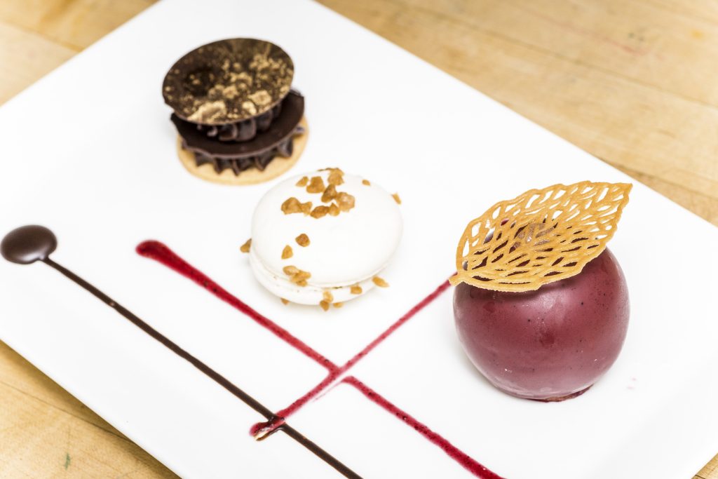 Three mignardises assembled in a plate by the pastry chef Vincent Coulange.