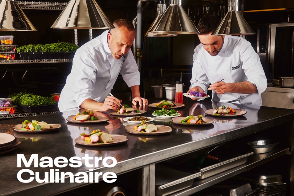 Two chefs from Maestro Culinaire setting up plates for an event at the Québec City Convention Centre.