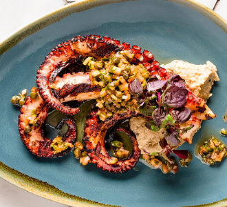 Colorful plate of food including a seafood.