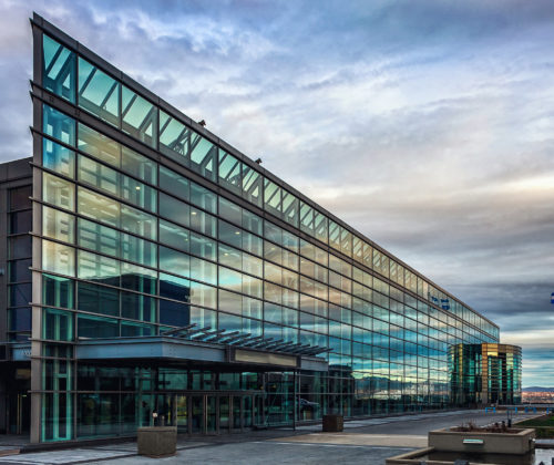 Québec City Convention Centre exterior facade with grey sky in the summer.