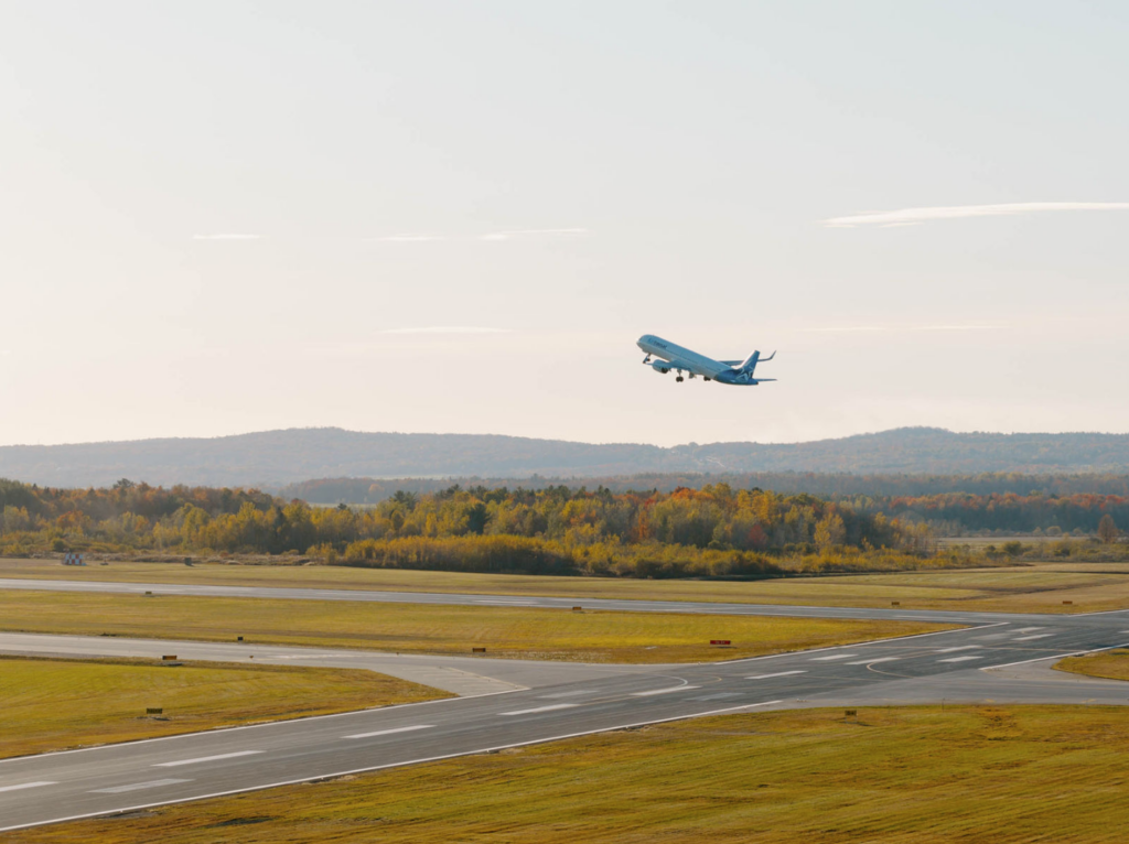 Airplane taking off from the runway at Québec City Jean Lesage International Airport